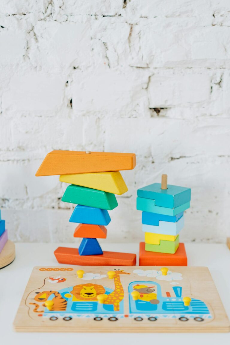 Vibrant wooden shapes and puzzle in a bright daycare setting.